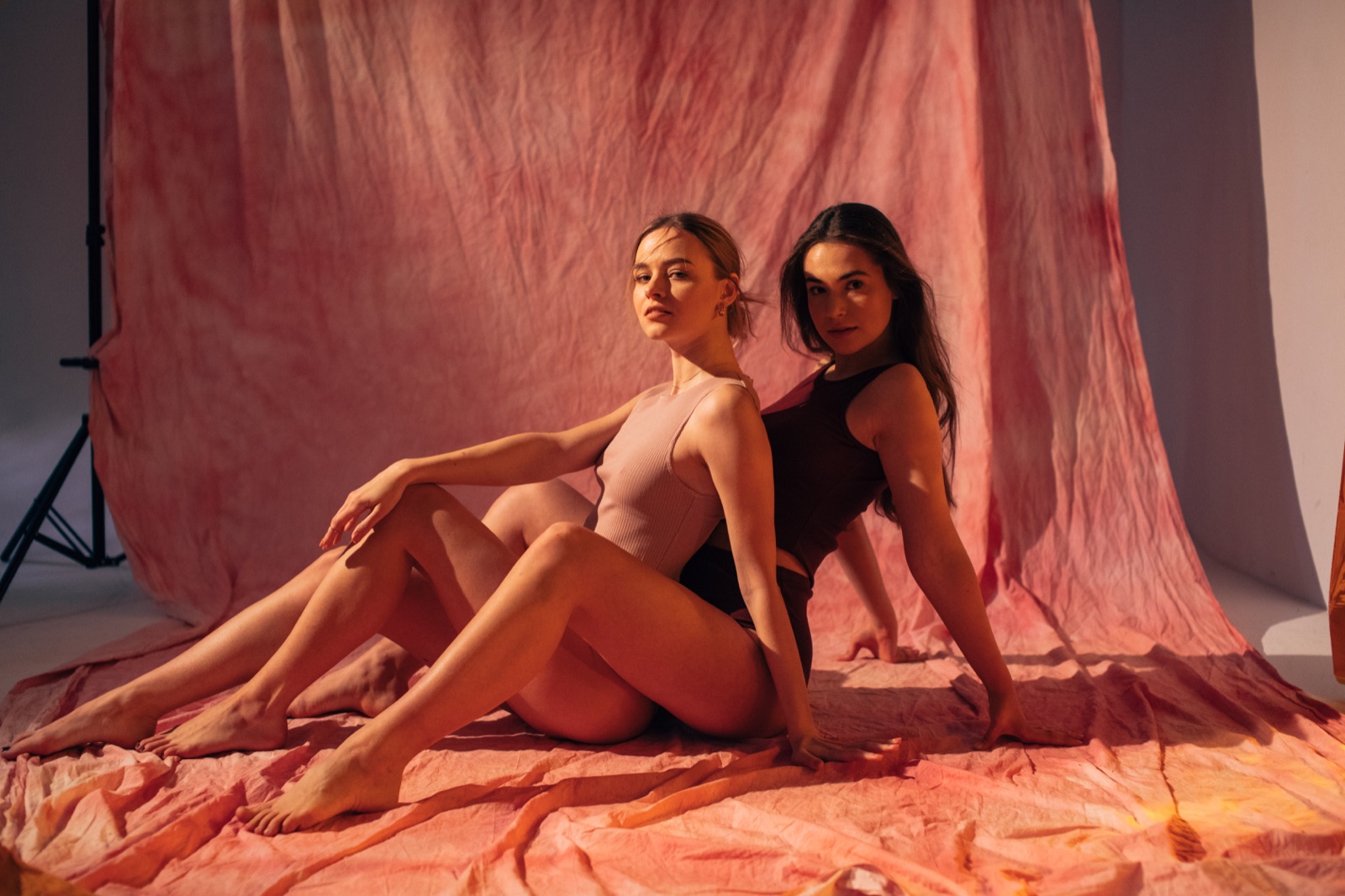 Two creators at a studio photoshoot, from the original XO website